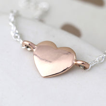 Sterling silver bracelet with rose gold heart